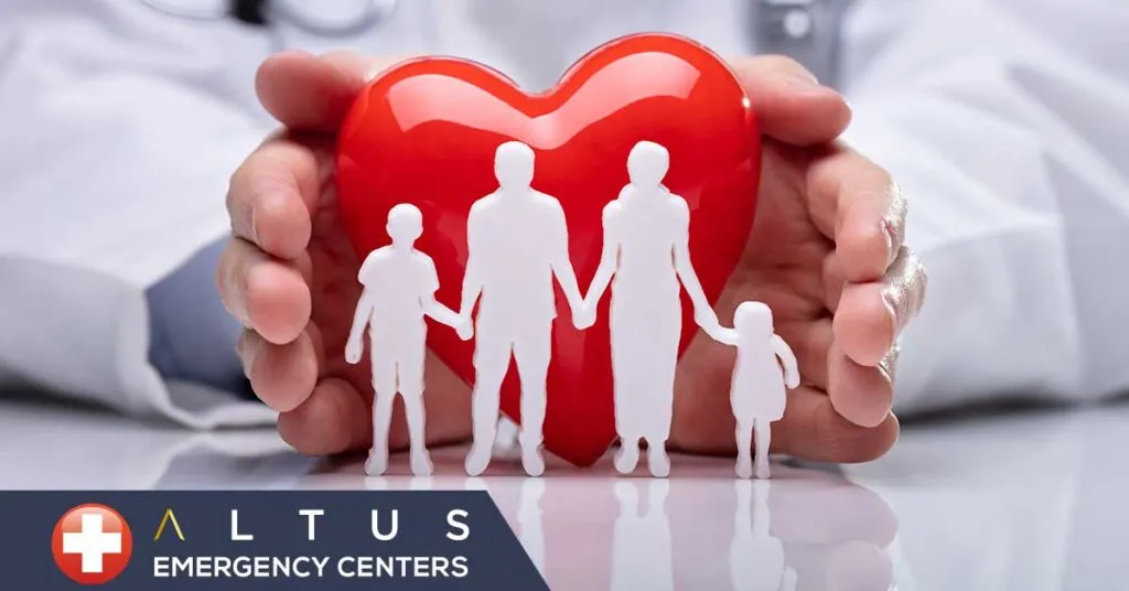 family in front of heart