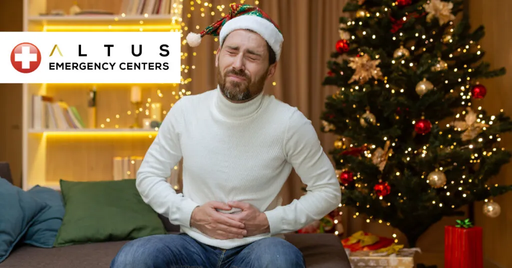 man in pain in front of Christmas decor
