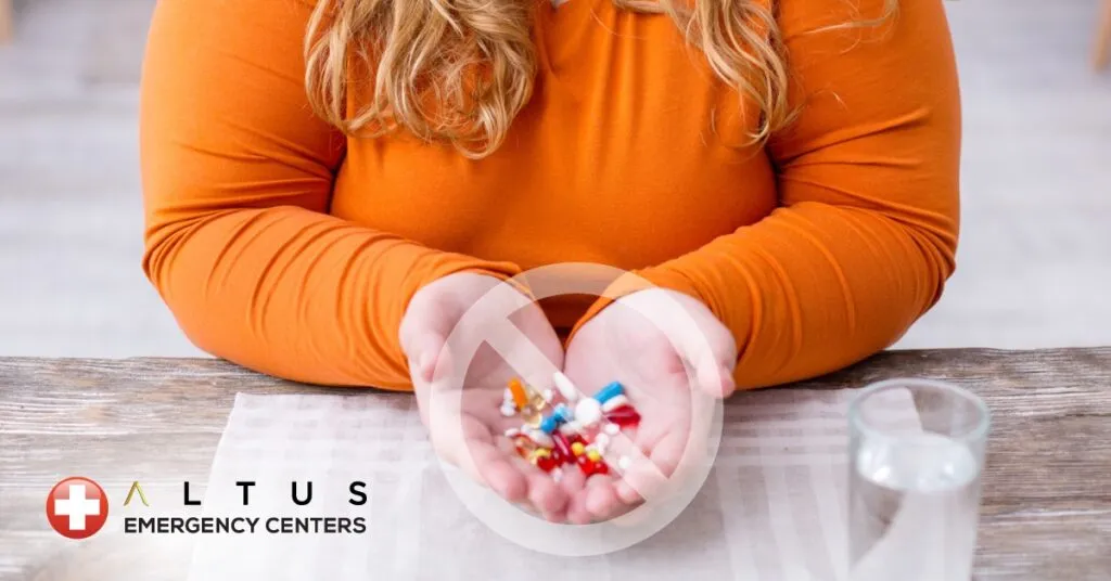 woman holding pills