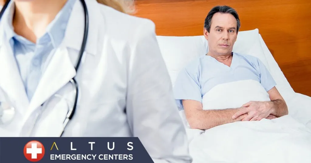 man lying in a hospital bed