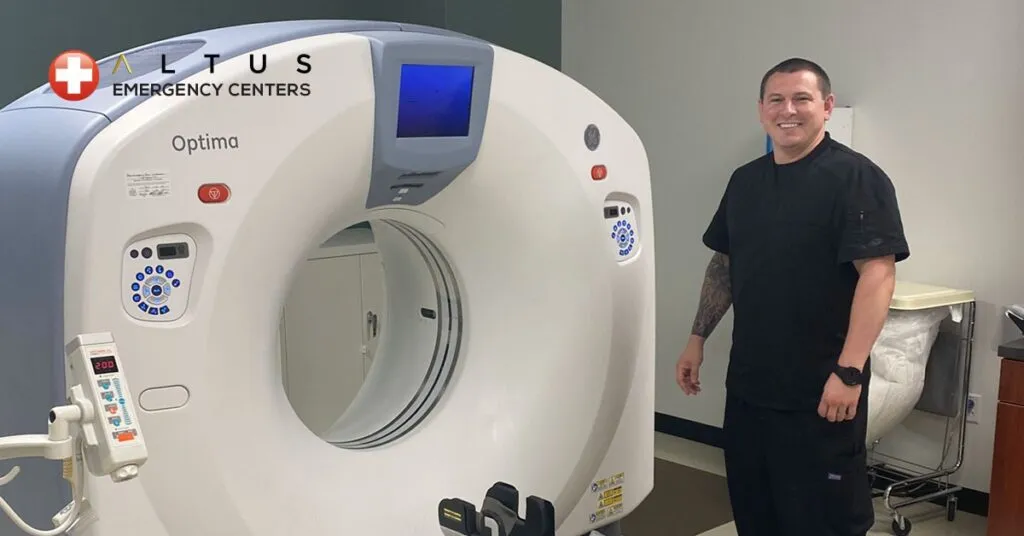 Altus Employee in front of a CT machine