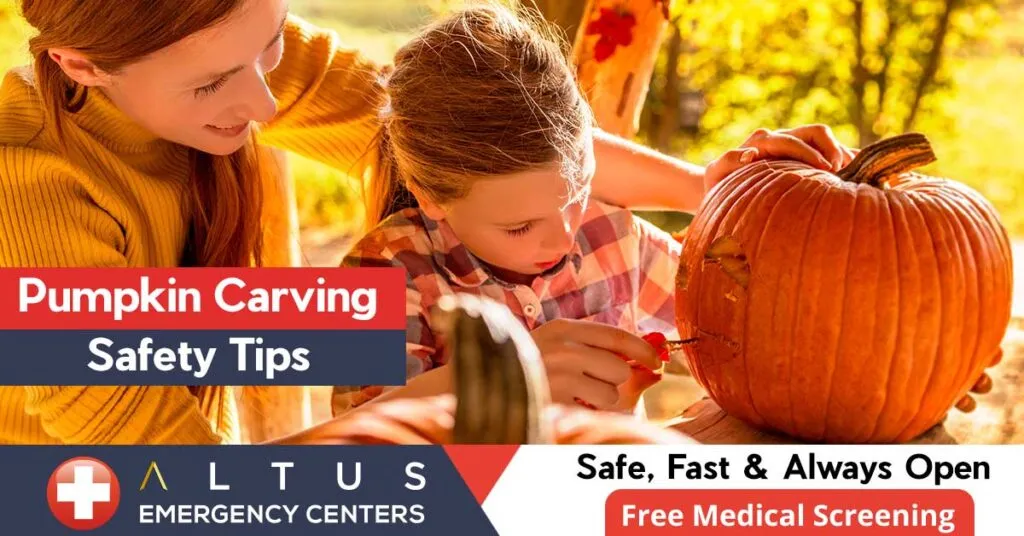 woman and daughter carving pumpkin