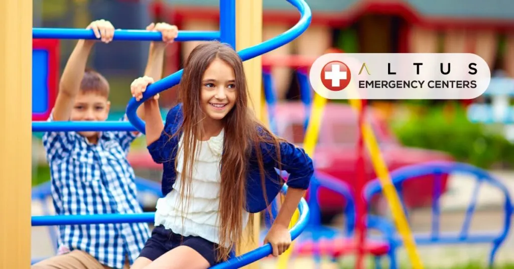 a boy and girl on a playground