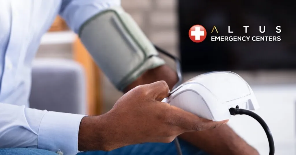 man measuring his blood pressure