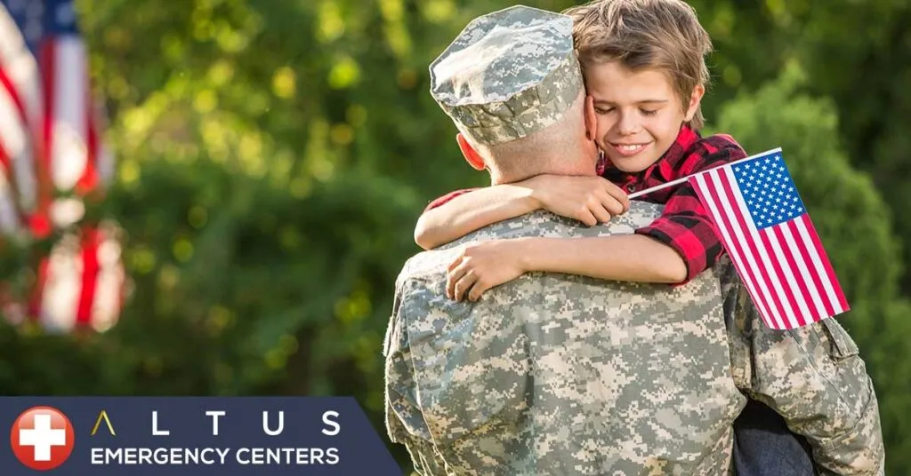 child hugging a veteran