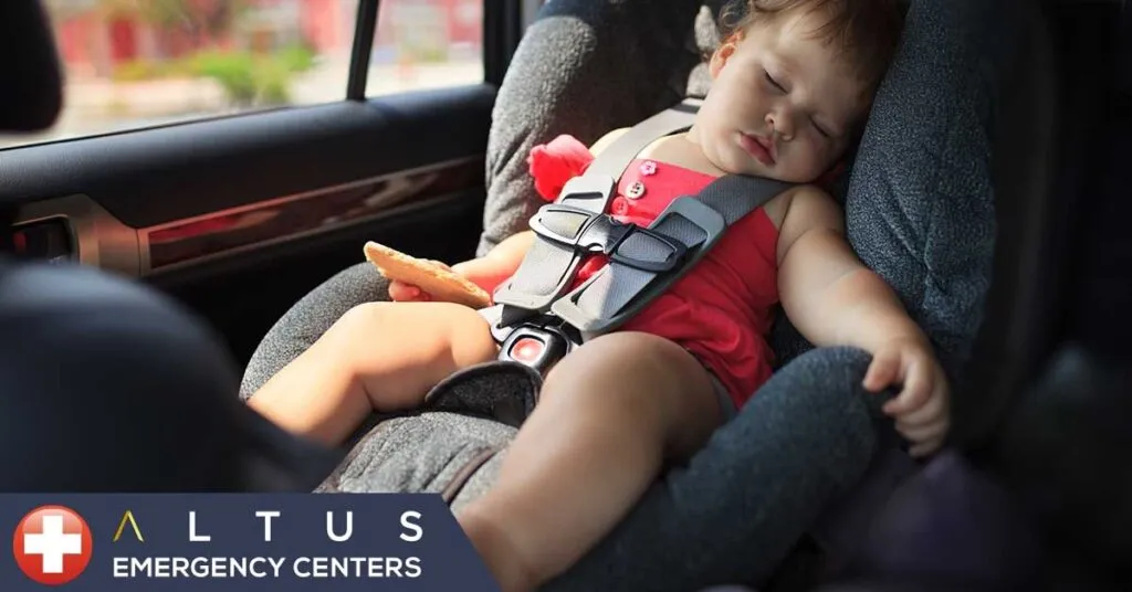 sleeping child in a carseat