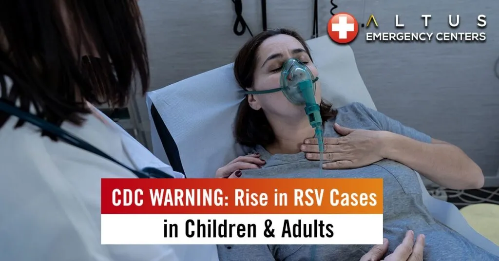 woman wearing an oxygen mask in a hospital bed