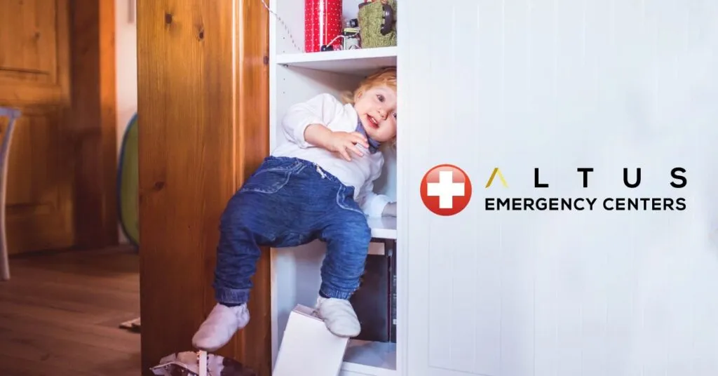 child playing in cabinets