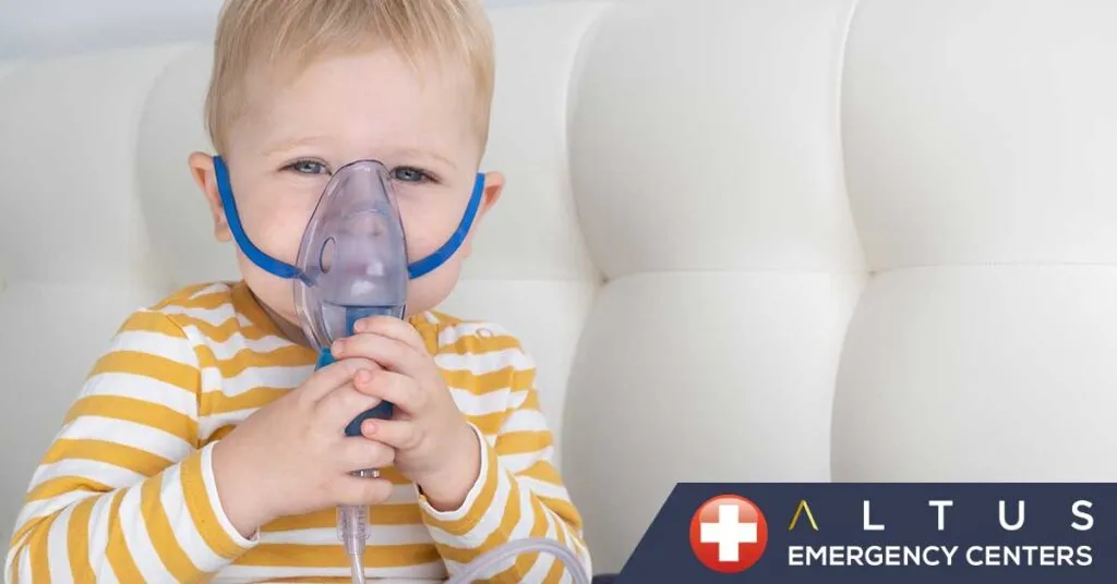 child using an oxygen mask