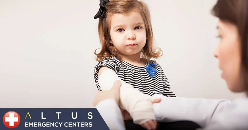 a child with a bandaged arm