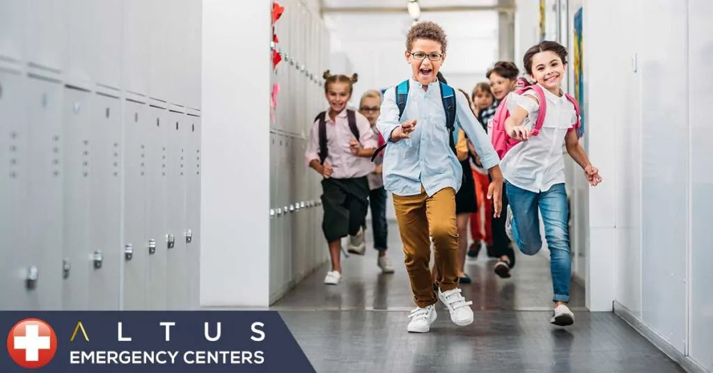children running through school hallway