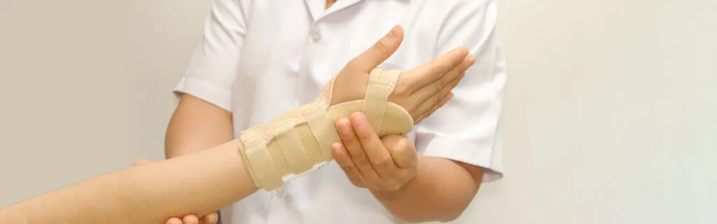 arm in a cast being held