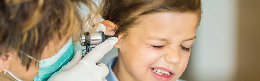 doctor checking a for an ear infection