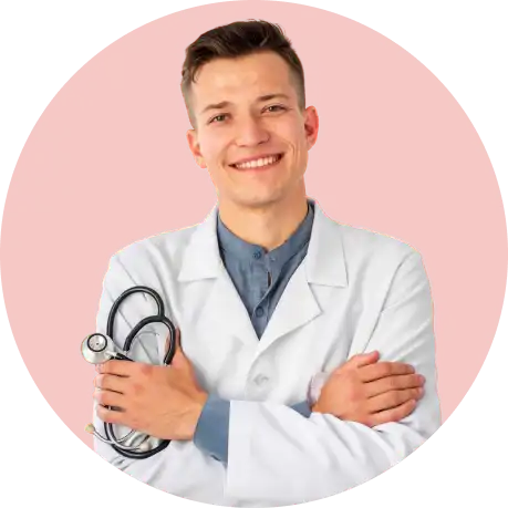A smiling male doctor wearing a stethoscope, representing our commitment to compassionate healthcare.