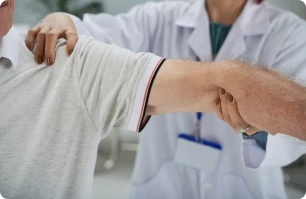 Doctor assisting a patient’s arm