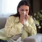 Person suffering from hay fever and allergies.