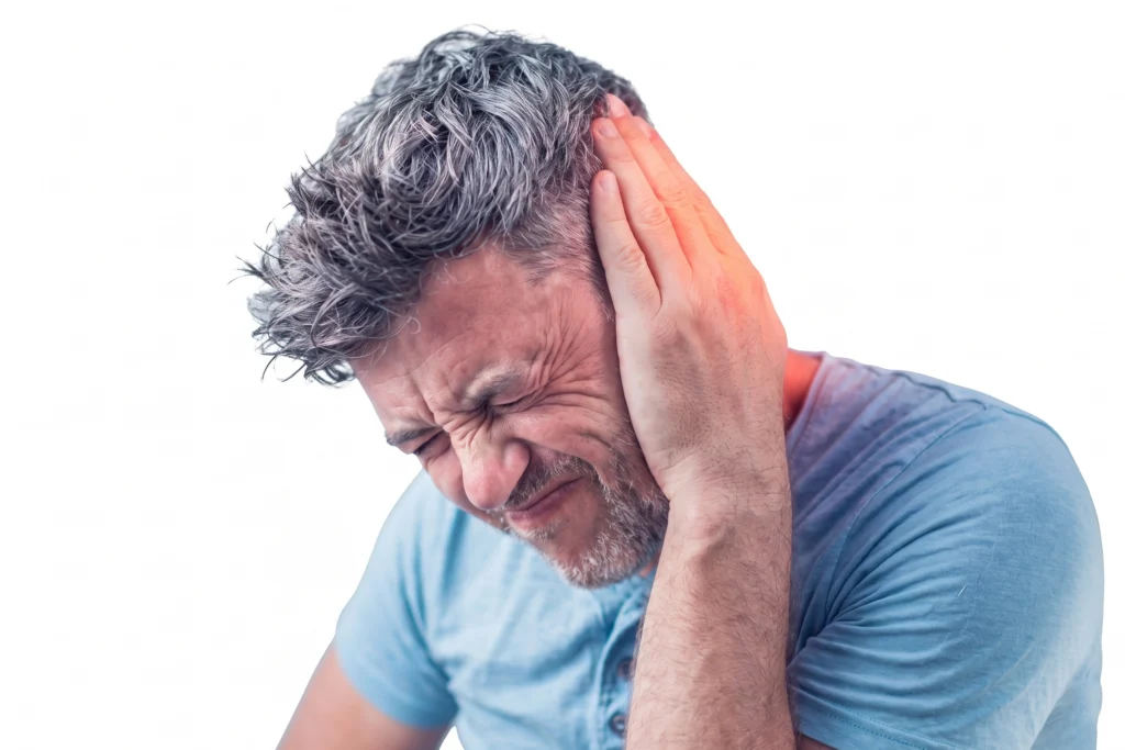 A man with a pained expression holding his ear, which is highlighted with a red glow to indicate discomfort or pain.