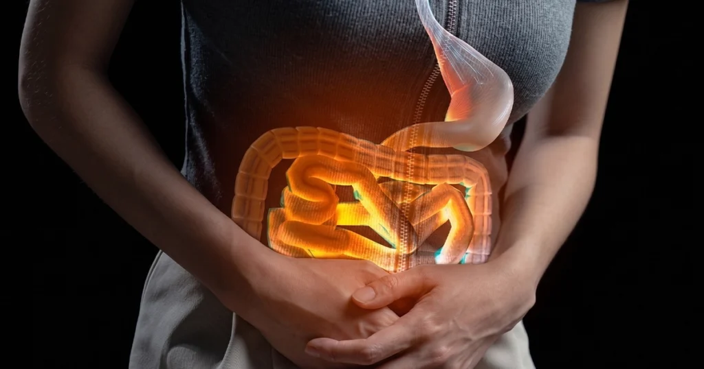 Woman holding stomach experiencing severe diarrhea.